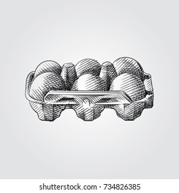 Huevos dibujados a mano en una caja Símbolo de esbozo aislado en fondo blanco. Desayuno vectorial en estilo moderno.