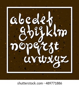 Hand drawn English alphabet on a brown grunge background with splashes. It can be used for the compilation of words and sentences.