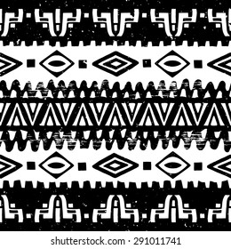 Hand drawn ethnic seamless background with grunge effect. African tribal pattern for your design. Use for fabric, pattern fills, web page background. Zigzag and stripe line
