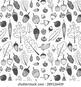 Hand drawn fall acorns and oak leaves background pattern.Black and white.