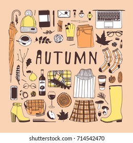 Hand drawn fall fashion illustration. Creative ink art work. Actual vector drawing. Autumn set: glove, watch, glasses, phone, headphones, jumper, jacket, skirt, boots, socks, bag, umbrella, hat