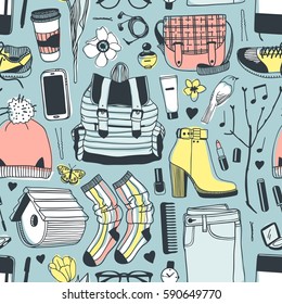 Hand drawn fashion illustration. Creative ink art work. Actual vector drawing spring look. Seamless pattern with street wear: boots, jeans, sneakers, backpack, bag, socks, skirt and other