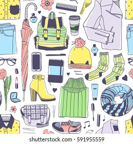 Hand drawn fashion illustration. Creative ink art work. Actual vector drawing spring look. Seamless pattern with street wear: boots, jeans, sneakers, backpack, bag, socks, skirt and other