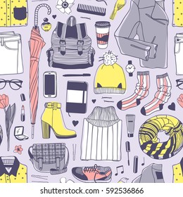 Hand drawn fashion illustration. Creative ink art work. Actual vector drawing spring look. Seamless pattern with street wear: boots, jeans, sneakers, backpack, bag, socks, skirt and other
