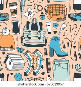 Hand drawn fashion illustration. Creative ink art work. Actual vector drawing spring look. Seamless pattern with street wear: boots, jeans, sneakers, backpack, bag, socks, skirt and other