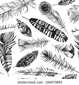Hand drawn feathers pattern in vector
