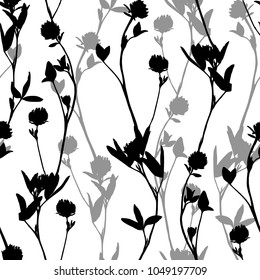 Hand drawn floral seamless pattern with clover silhouettes isolated on white. Cute graphic flower background. Summer concept. Design element for textile, fabrics, scrapbooking, wallpaper and etc. Vect