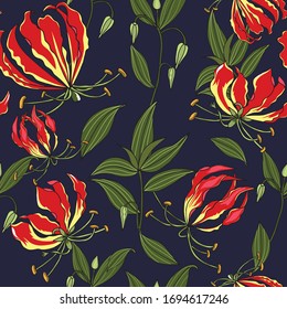 hand drawn floral seamless pattern of flame lily flower on dark blue background