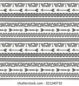 Hand drawn geometric ethnic seamless pattern. Wrapping paper. Scrapbook paper. Doodles style. Tiling. Tribal native vector illustration. Aztec background. Stylish ink graphic texture.