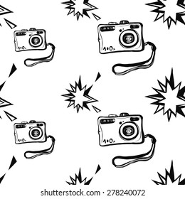 Hand drawn graphic black and white sketched camera and flash. Set of modern photo items seamless pattern. Hatched line art sketch on white background 