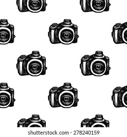Hand drawn graphic black and white sketched camera. Set of modern photo items seamless pattern. Hatched line art sketch on white background 