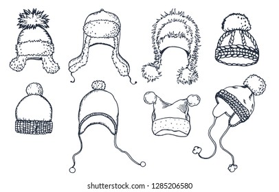 Hand drawn graphic set of warm hats and caps. Vector illustration