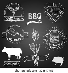 Hand drawn grill and barbecue labels and elements on the black board