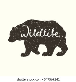 Hand drawn grunge bear silhouette with handwriting inscription Wildlife