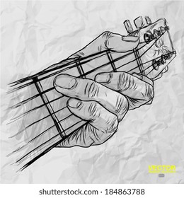 hand drawn of had playing guitar on crumpled paper background 