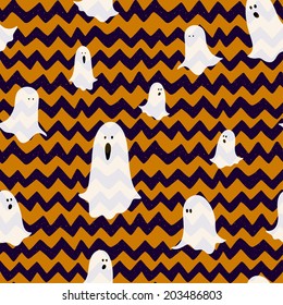 Hand drawn halloween seamless pattern with cartoon spooky ghosts on doodle chevron background.