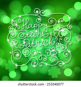 Hand - drawn Happy St. Patrick lettering with frame and clovers on green bokeh background.