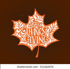 Hand drawn Happy Thanksgiving lettering typography poster. Celebration quotation on textured background for postcard, icon, logo or badge. Vector calligraphy  text with maple leave on dark background