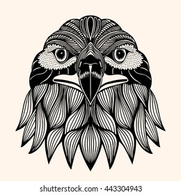 Hand Drawn head of eagle. Detailed illustration. Vector artwork. Black, beige color. Sketch for tattoo or indian makhenda design. Can be used for postcard, t-shirt, bag or poster.
