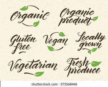 Hand drawn healthy food letterings. Organic, organic product, gluten free, vegan, locally grown, vegetarian, fresh produce. Label, logo template against recycled paper background. Eps 10 vector.