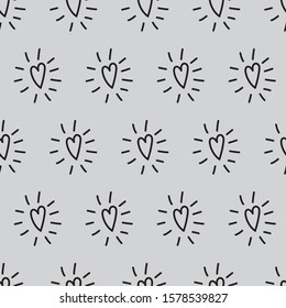 Hand drawn hearts with rays cheerful seamless pattern. Hearts and rays girlie black at grey background for textile texture, cover paper, books, stickers, invitation concept design.