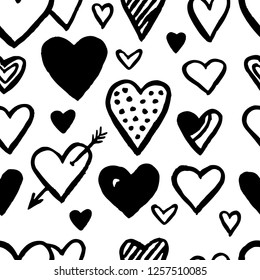 Hand drawn hearts seamless pattern in black and white. Valentine's day background. Romantic vector illustration.
