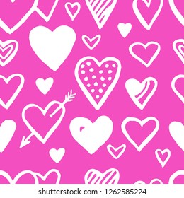 Hand drawn hearts seamless pattern in white over pink. Valentine's day background. Romantic vector illustration.
