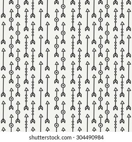 Hand drawn hipster seamless pattern with ethnic arrows. Wrapping paper. Scrapbook paper. Doodles style. Tiling. Tribal native vector illustration. Aztec background. Stylish graphic texture.