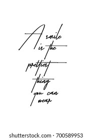 Hand drawn holiday lettering. Ink illustration. Modern brush calligraphy. Isolated on white background. A smile is the prettiest thing you can wear.