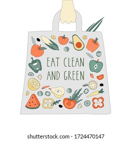 Hand drawn illustrated lettering quote - eat clean ang green. Appetizing detailed traced vegetables, fruits in a eco bag with hand. Great typography for poster, card, eco market, shop, restaurant