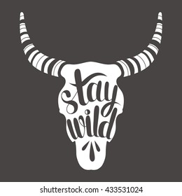 Hand drawn illustration with animal skull and lettering. Sketch background vector. Doodle backdrop Stay wild. Black and white poster design and motivational concept