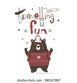 hand drawn illustration of baby bear travelling with hand drawn lettering "travelling is fun"/can be used for kid's or baby's shirt design/fashion print design