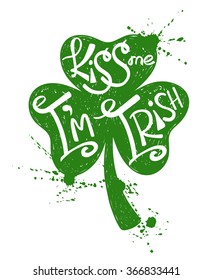 Hand drawn illustration of isolated green shamrock leaf silhouette on a white background. Typography St. Patrick's day poster with text kiss me I'm Irish.
