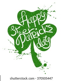 Hand drawn illustration of isolated green shamrock leaf silhouette on a white background. Typography St. Patrick's day greeting card.