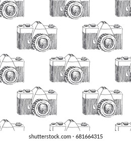 Hand drawn illustration of vintage mechanical film camera isolated on white. Vector seamless pattern. Sketch style