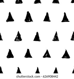 Hand drawn ink black triangles isolated on white background. Seamless black and white pattern in naive minimalistic style. Vector illustration.