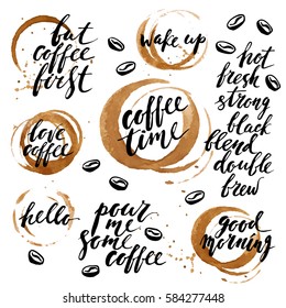 Hand drawn ink lettering with coffee cup prints and stains. Good morning, love, hello, wake up, but coffee first.