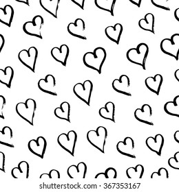 Hand drawn with ink seamless pattern with black hearts