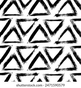 Hand drawn ink triangles seamless pattern. Trendy monochrome doodles and brush marks. Simple abstract background. Great for textile, fabric, wallpaper, wrapping, scrapbook and packaging
