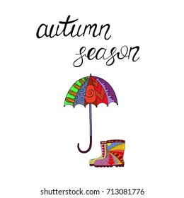 Hand drawn inspirational phrase Autumn season with rubber boots and umbrella. Calligraphy lettering for prints, posters and t-shirt design.