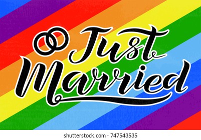 Hand drawn Just Married lettering with wedding rings on rainbow background. Gay rights concept. Vector hand lettering, homosexuality emblem. Banner, poster, placard, invitation card typographic design