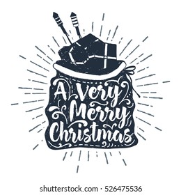 Hand drawn label with textured Santa's sack of gifts vector illustration and "A very Merry Christmas" lettering.