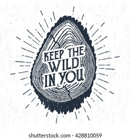 Hand drawn label with textured tree trunk vector illustration and "Keep the wild in you" lettering.