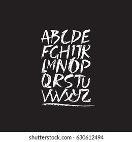 Hand drawn latin alphabet. Vector ABC isolated on the background and easy to use for your lettering design. Sketchy script. White chalk on the black board.
