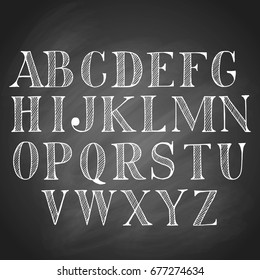 Hand drawn latin chalk vintage alphabet, set of black upper-case capital letters, isolated on blackboard background.