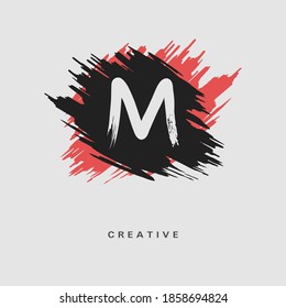 Hand drawn Letter M Logo on colorful brush strokes background. Initial white paint brush stroke letter M Logo Design. Creative template for logotype, emblem, monogram, jewelry, cosmetic or brand name.