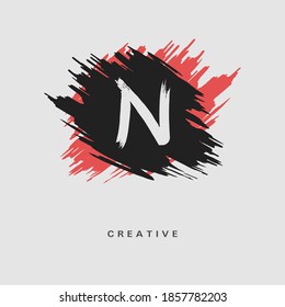 Hand drawn Letter N Logo on colorful brush strokes background. Initial white paint brush stroke letter N Logo Design. Creative template for logotype, emblem, monogram, jewelry, cosmetic or brand name.