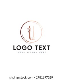 A hand drawn letter type U with delicate floral 