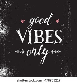 Hand drawn lettering good vibes only on black background