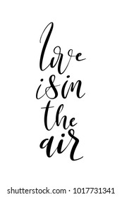 Hand drawn lettering. Ink illustration. Modern brush calligraphy. Isolated on white background. Love is in the air.